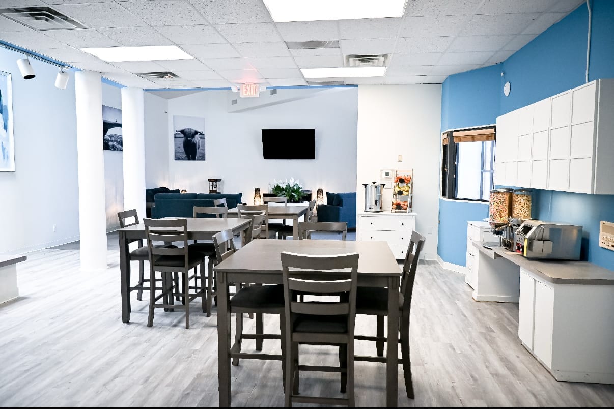 Community dining and common room with a coffee station and lounge seating at Ascend Recovery Center Albuquerque