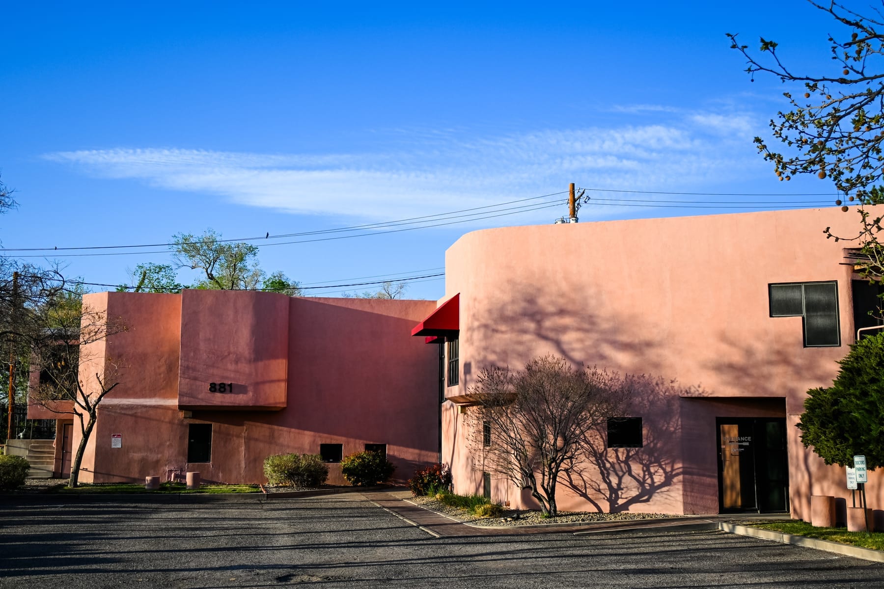 The Ascend Recovery Center building exterior at 881 Lead Ave SE in Albuquerque, New Mexico, a Southwestern adobe facility under a clear blue sky